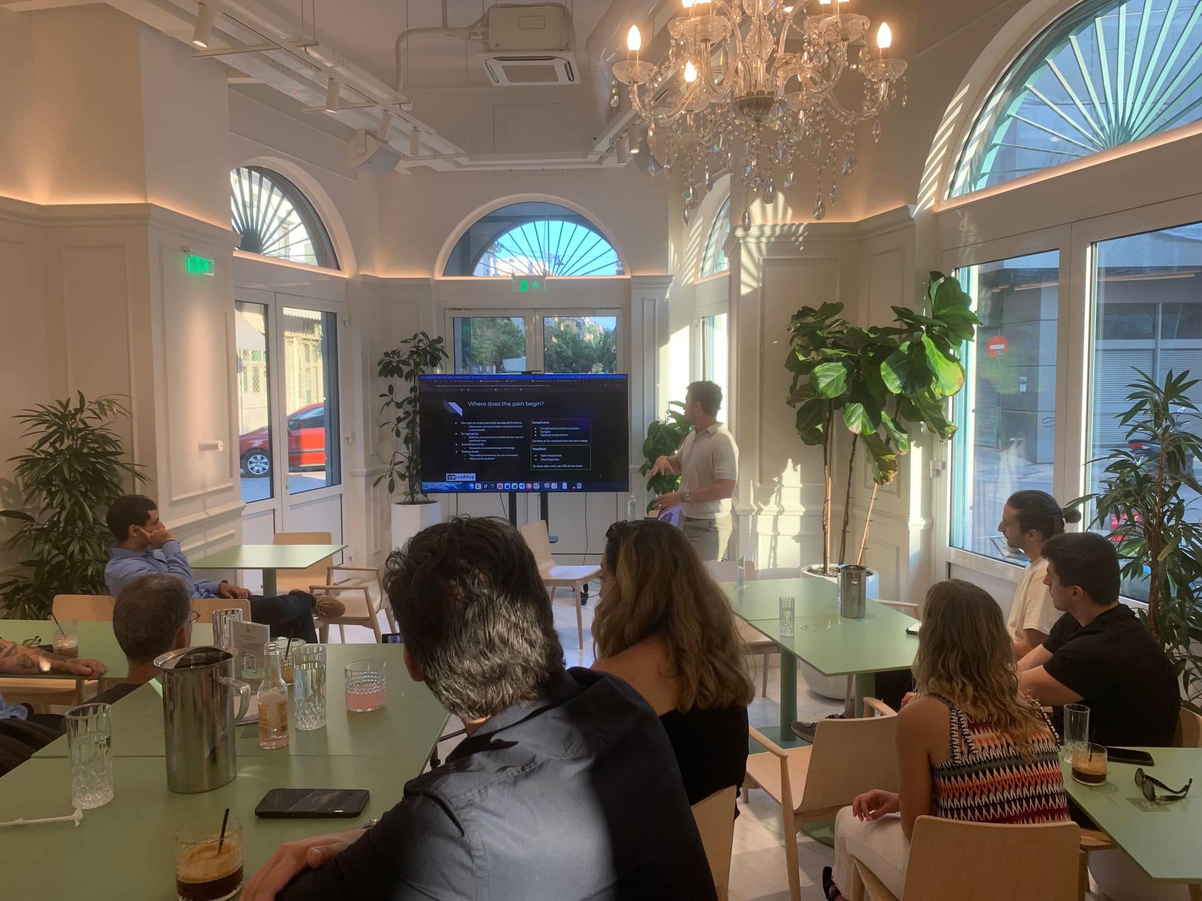A speaker presents to an audience at DeepStation Greece's meetup in Athens