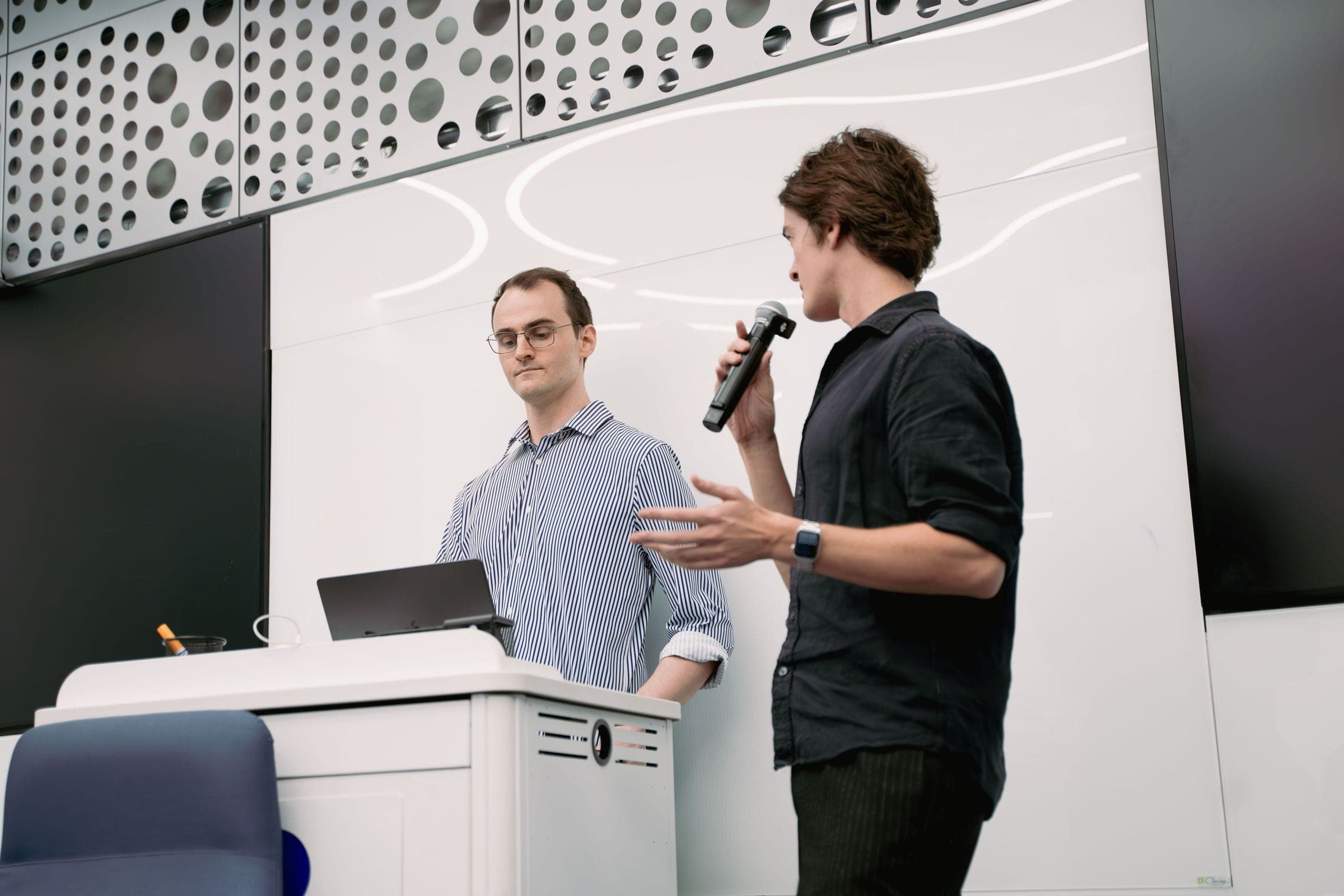 Two speakers present from the podium at the AI Center, Miami Dade College