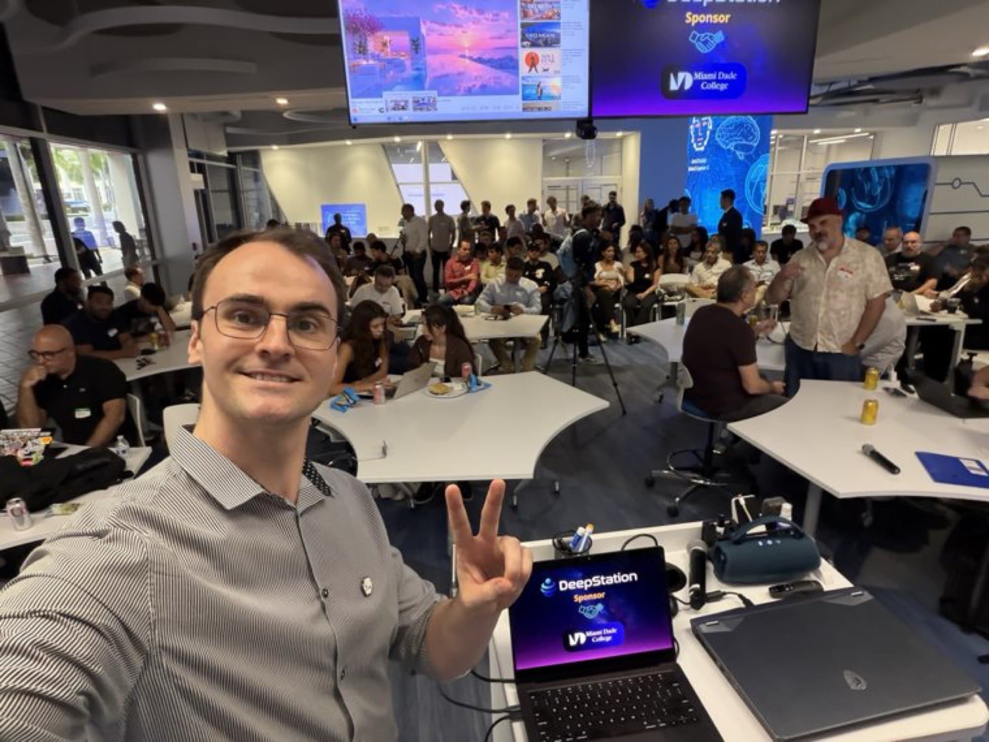 DeepStation's founder, Grant Kurz, takes a selfie with members at AI Demo Night